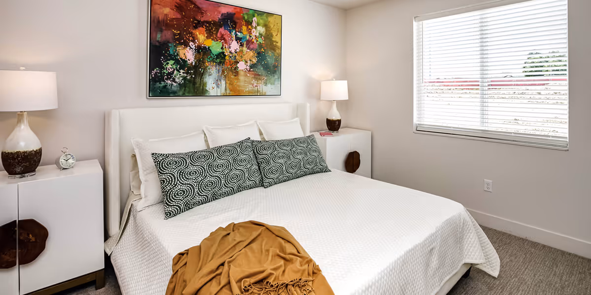 Furnished bedroom with bed and nightstands