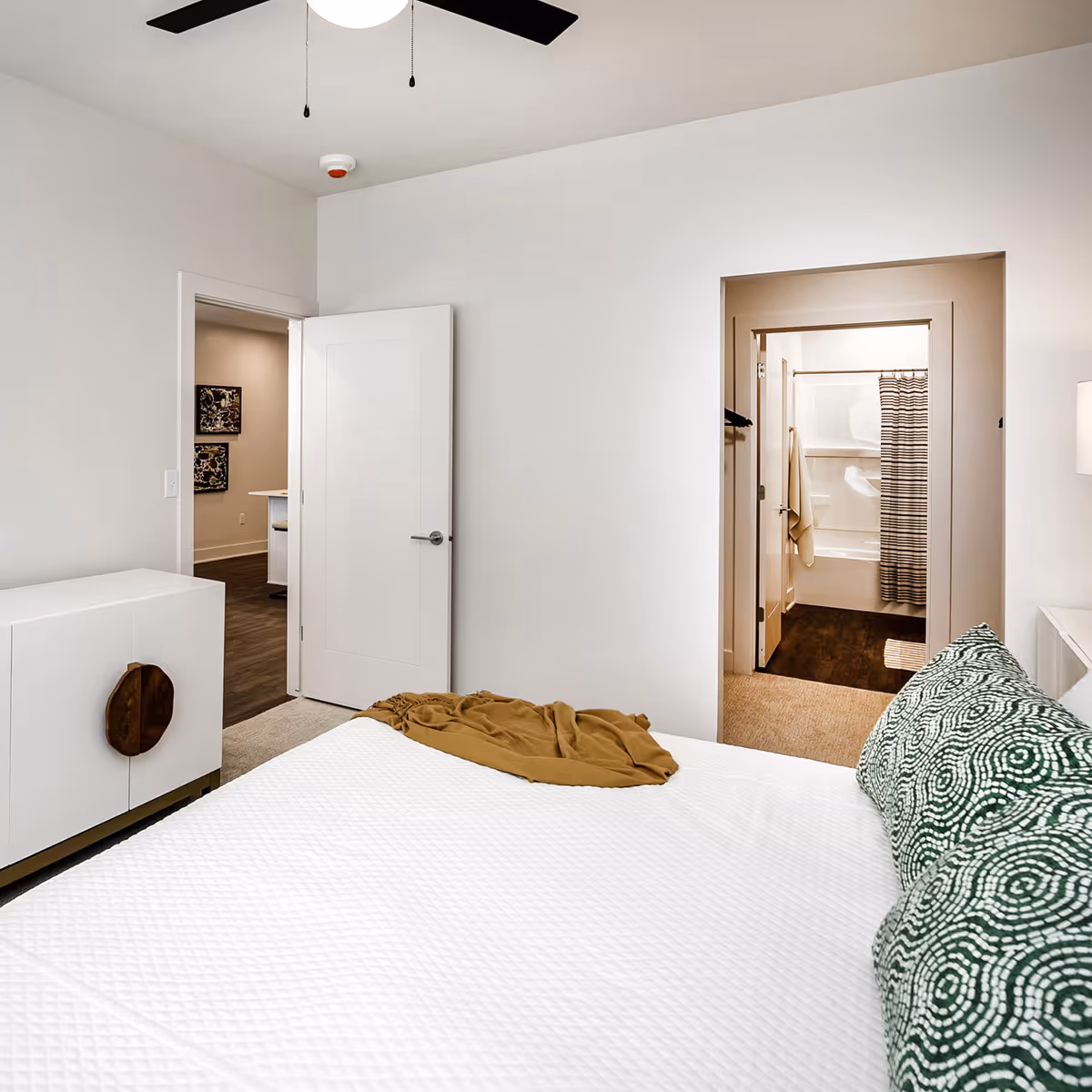 View from bed looking into bathroom and walk in closet