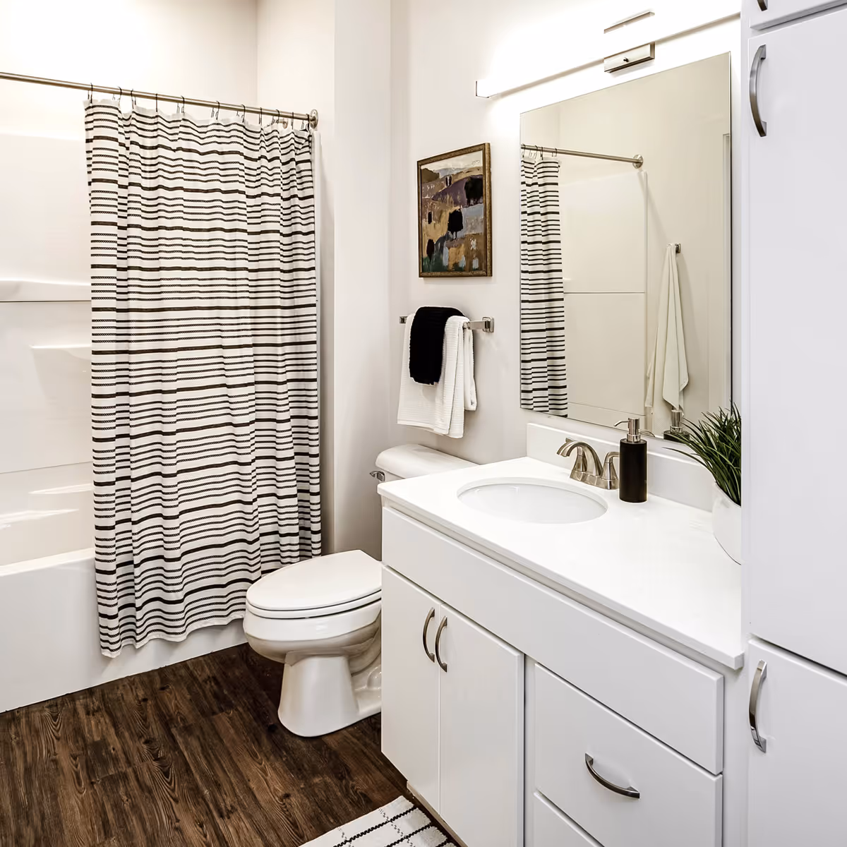 Bathroom with sink, toilet, and shower