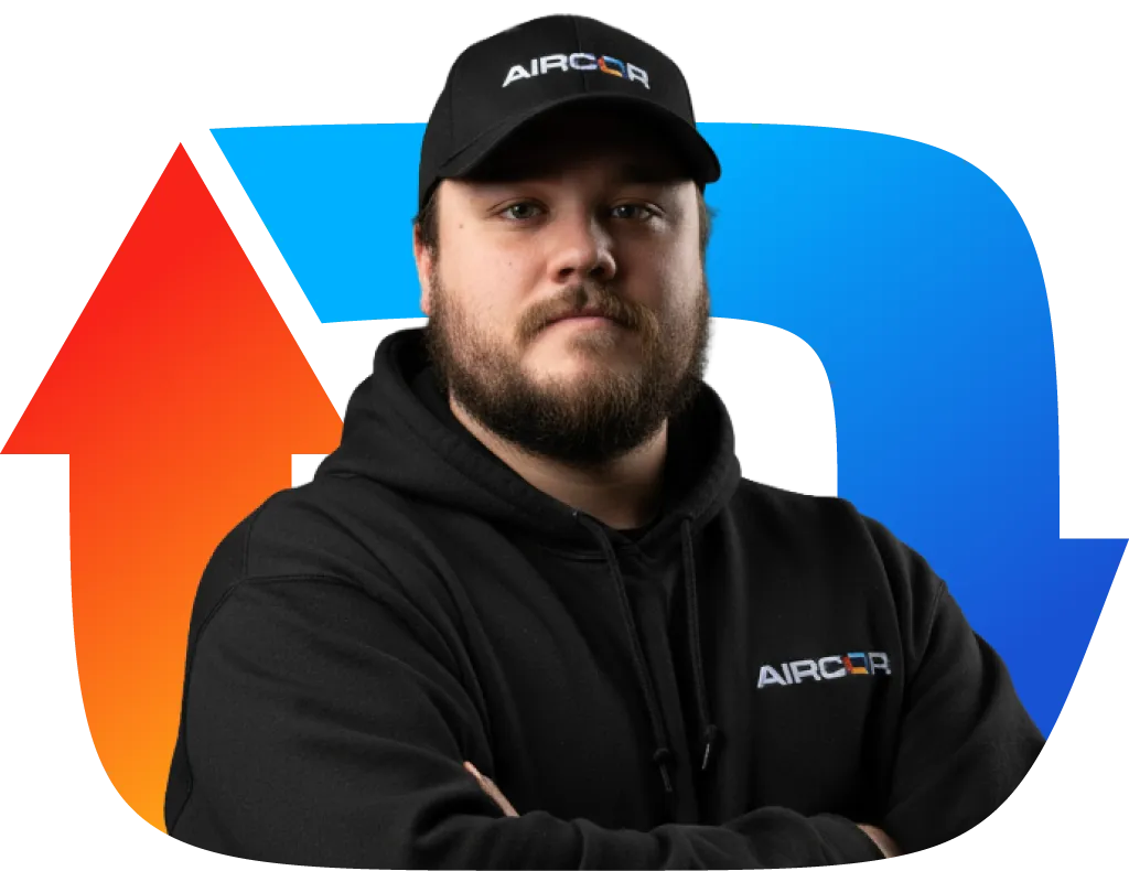 Man with beard wearing black Aircor cap and hoodie standing with arms crossed in front of red and blue circular arrows.