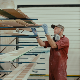 Workshop racking holding components for paint display fixtures.