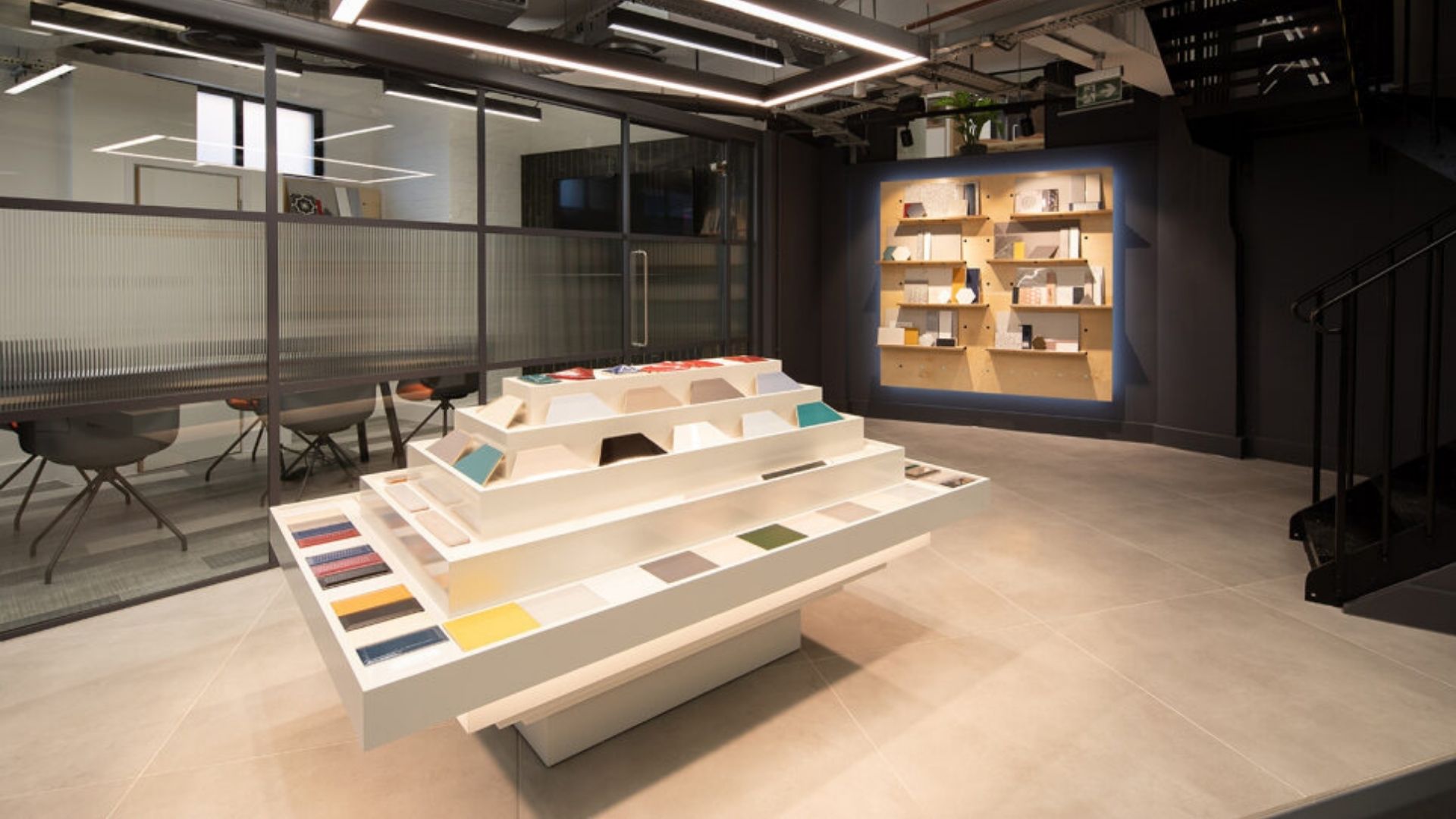 Tiered sample display table in modern showroom space