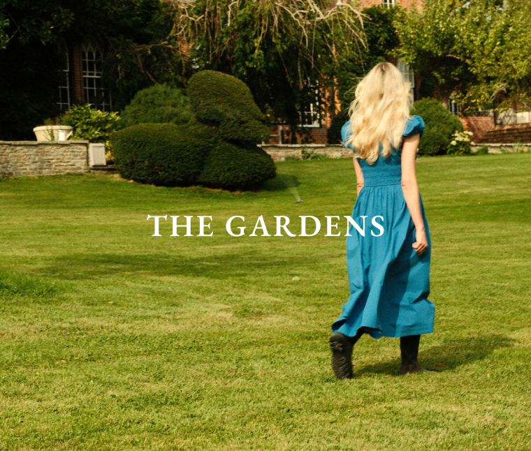 Catherine walking across gardens