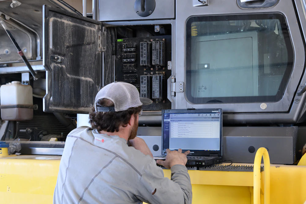 Diesel mechanic performing truck inspection in Seguin, TX