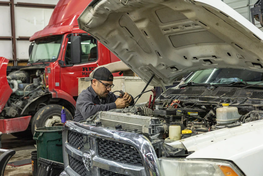 Diesel mechanic performing preventive maintenance in Seguin, TX