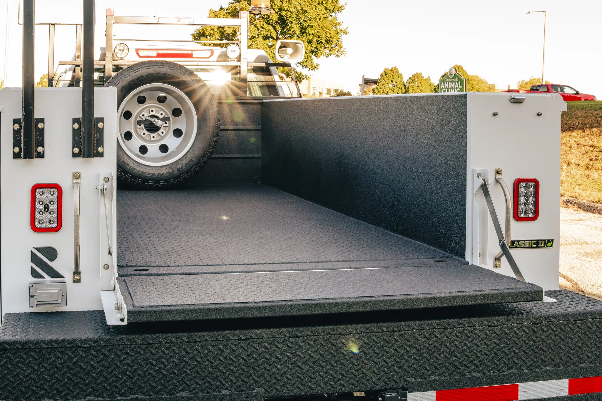 Service truck bed with freshly applied spray-in bedliner by Madison Auto Trim, Wisconsin. Durable protective coating, spray-in truck bed liner, anti-scratch and corrosion-resistant vehicle protection.