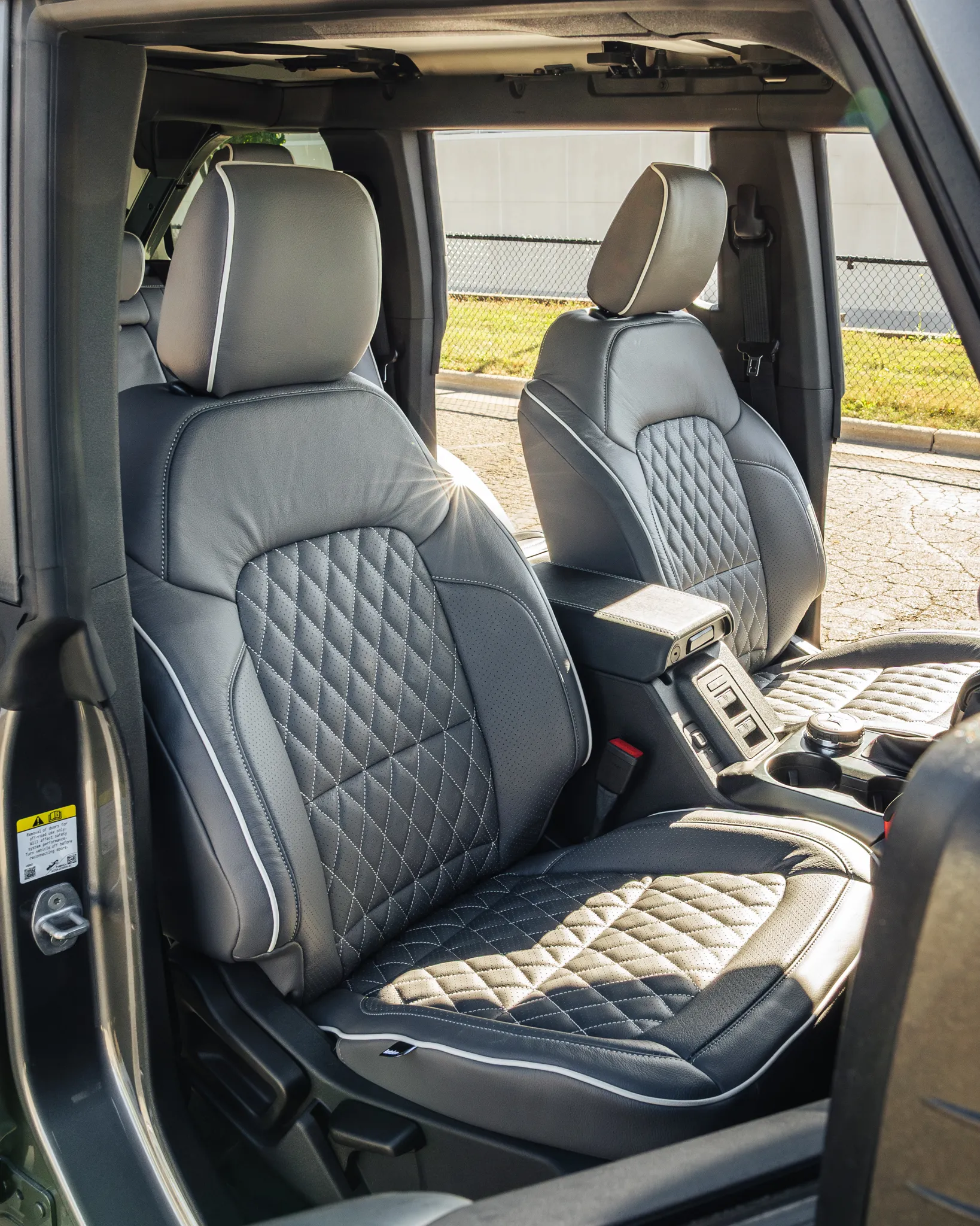 A single row of grey and white custom Katzkin leather front seats professionally installed by Madison Auto Trim, Wisconsin.