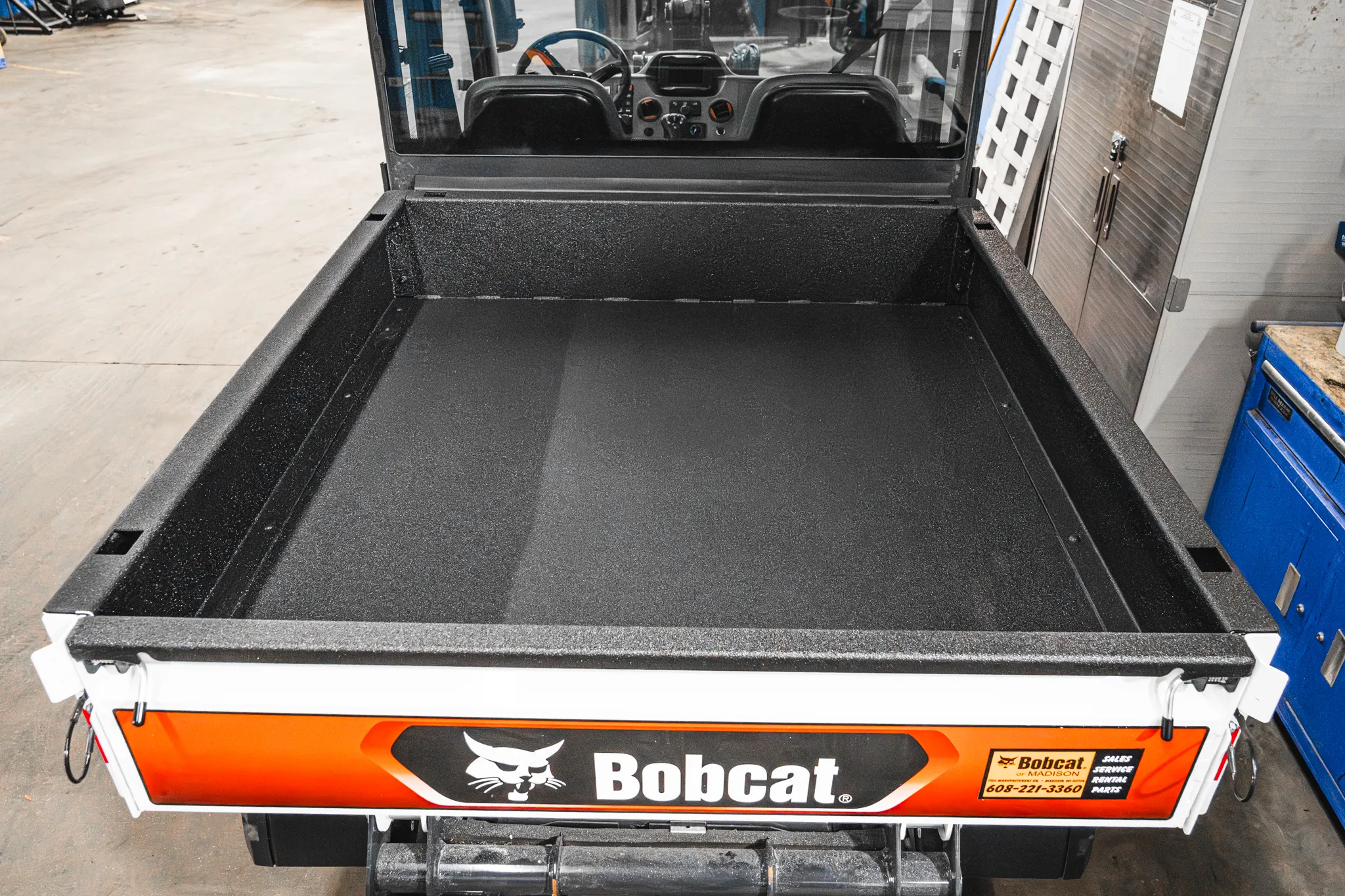 UTV bed with fresh spray-in bedliner coating by Madison Auto Trim, Wisconsin. Protective automotive surface coating, anti-scratch finish, and durable vehicle bedliner services.