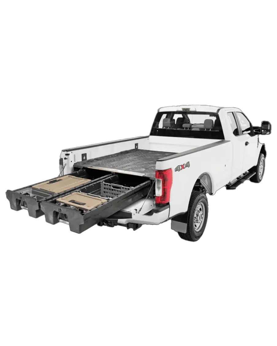 A white 4x4 truck with an open tailgate showing off decked storage cargo and extended management systems.
