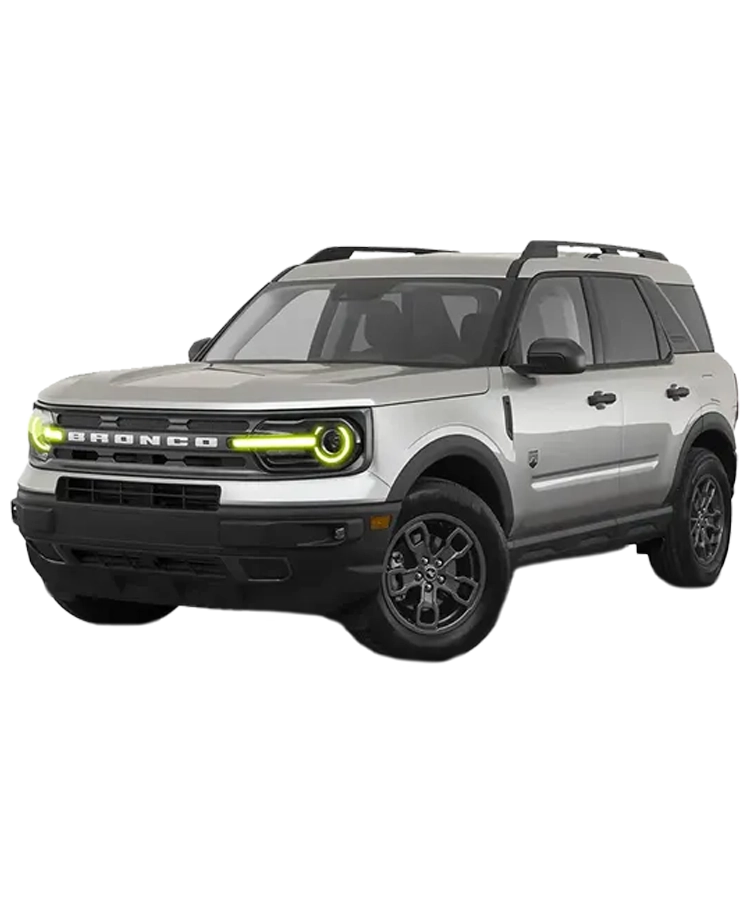 A light grey Bronco with lime green Oracle Lighting headlights displaying Ford Bronco accessories available online at Madison Auto Trim, LLC.