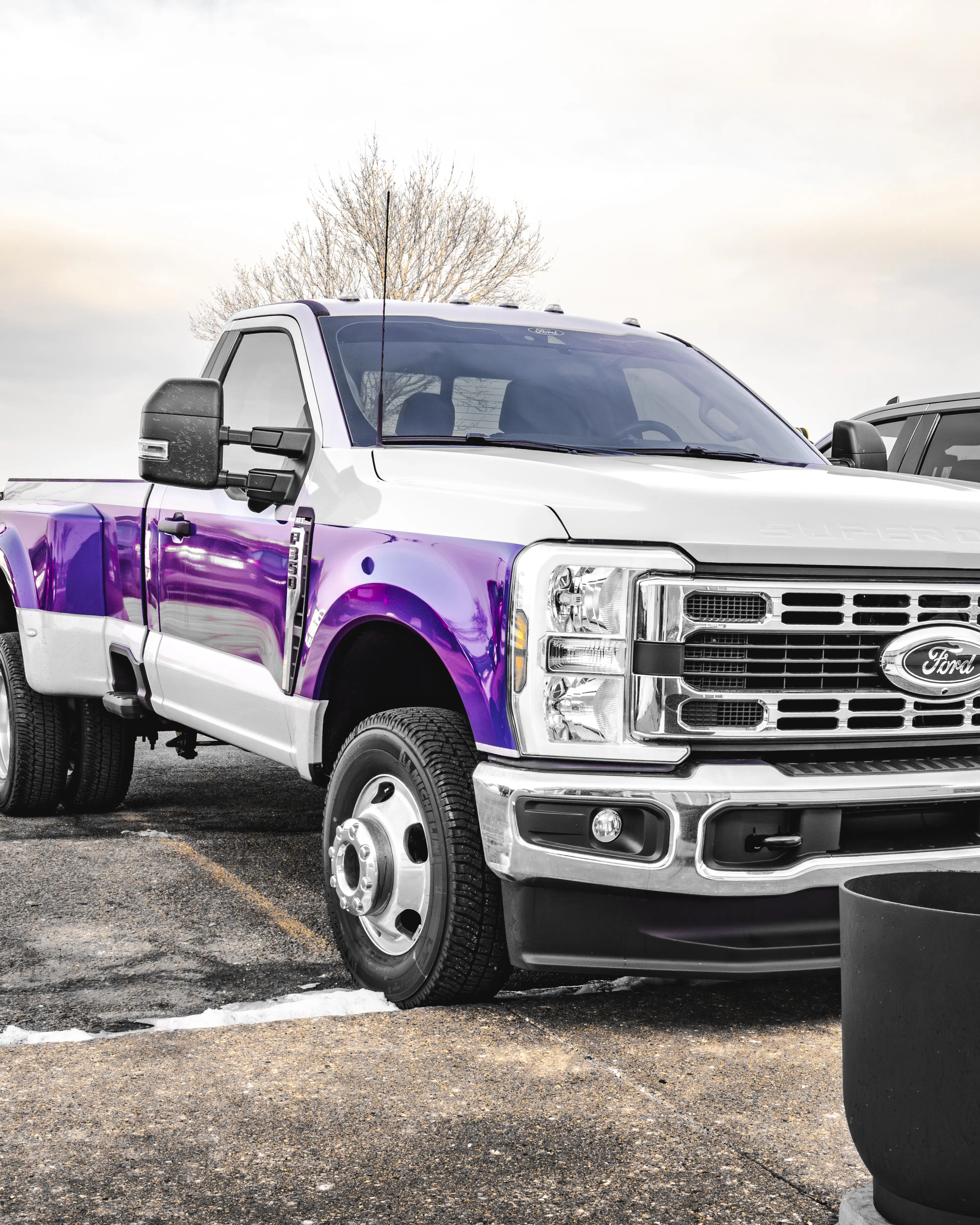 Three seats in a single row of grey and white custom Katzkin leather rear seats professionally installed by Madison Auto Trim, Wisconsin.