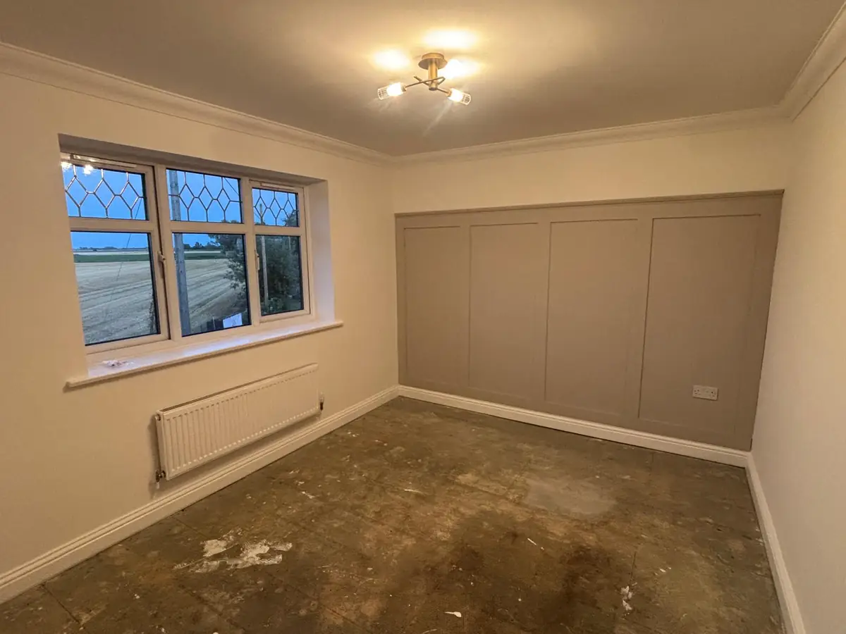 New-build bedroom in Hampton before: bare subfloor