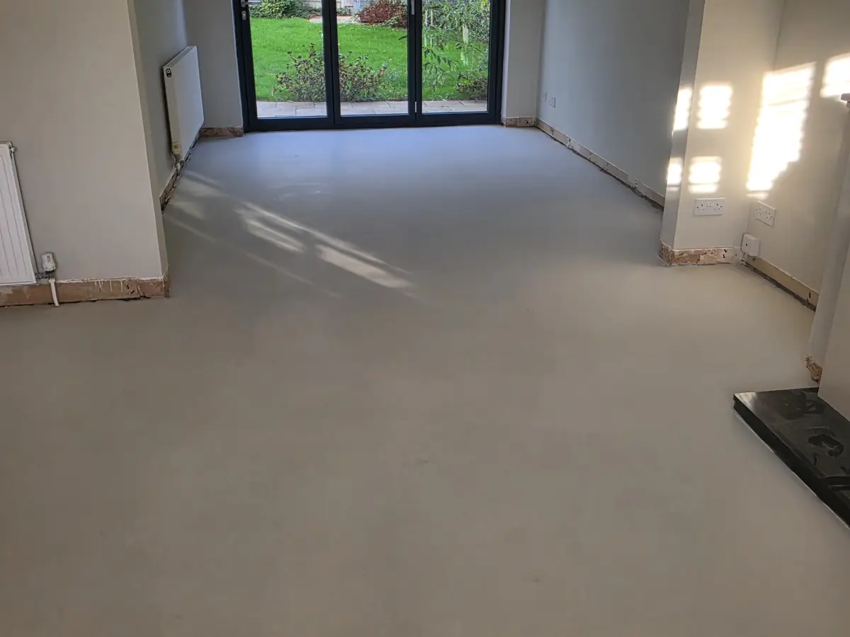 Living room before: floor screeded and levelled, ready for engineered wood