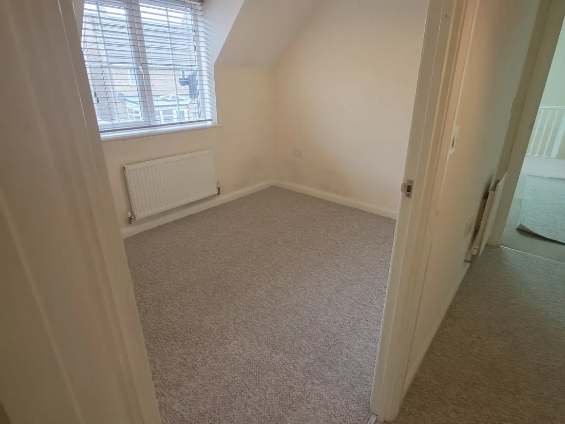 Grey twist carpet fitted wall to wall in a loft bedroom