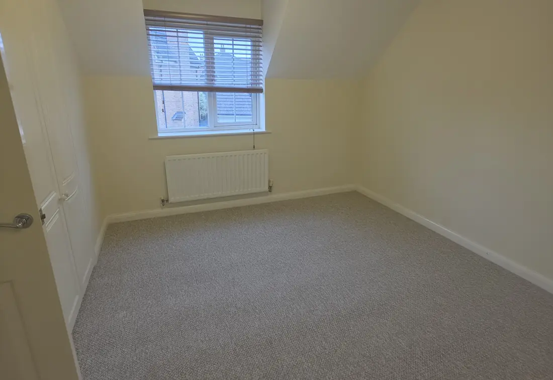 Grey twist carpet newly fitted in a loft bedroom