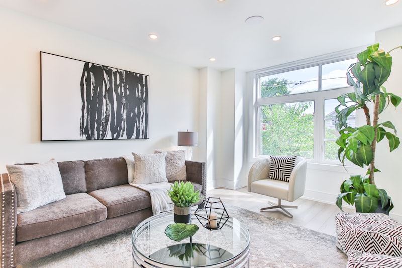 Neutral-toned modern living room with plush carpet, sofa and natural light — Cormar carpet fitting in Peterborough by Cambridgeshire Carpets