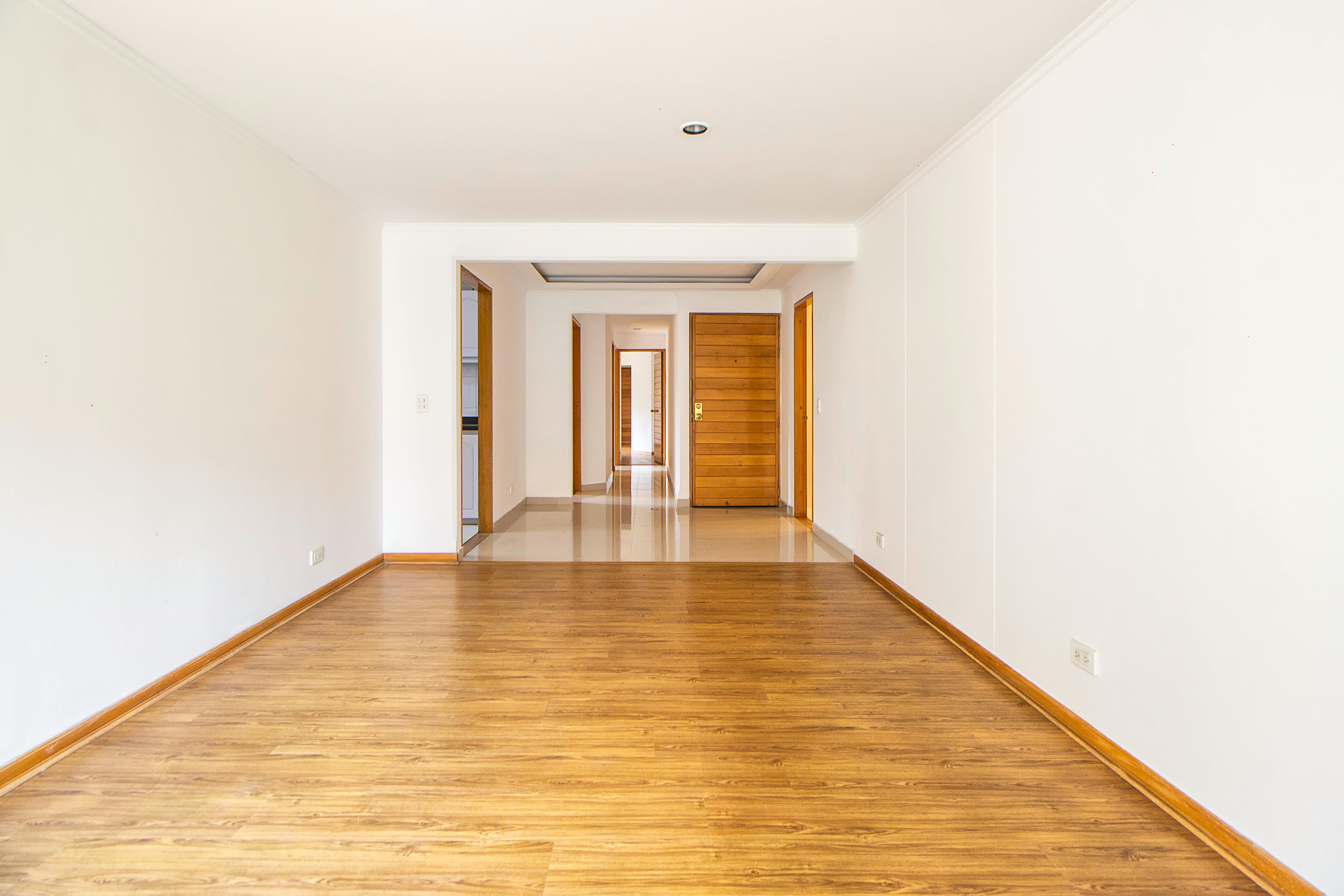 Engineered wood plank flooring in a spacious modern Peterborough home interior — Cambridgeshire Carpets Ltd supply and fit engineered wood and LVT flooring across PE1–PE7