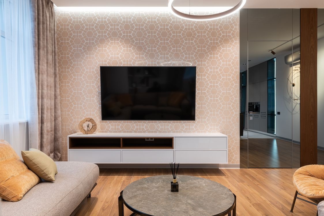 Warm-toned flooring in a naturally lit Peterborough living room — carpet and LVT tone guide by Cambridgeshire Carpets