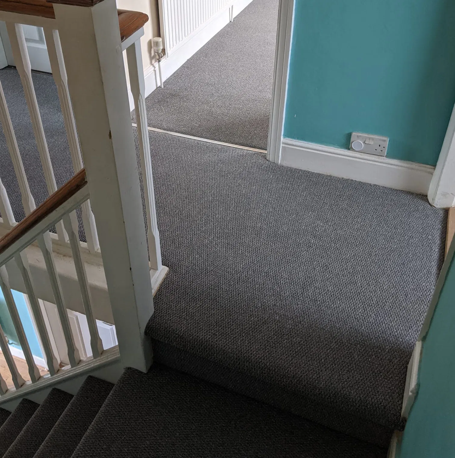 Freshly fitted grey carpet on a Peterborough staircase and landing — Cambridgeshire Carpets