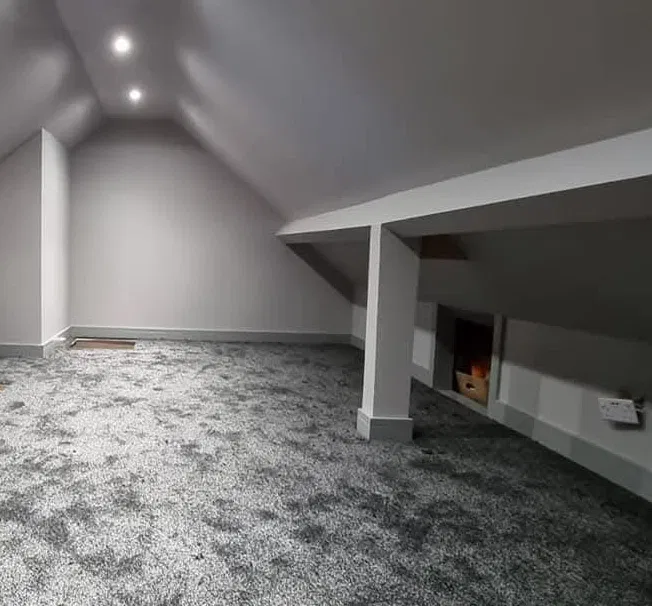 Neutral carpeted loft conversion with a clean professional finish