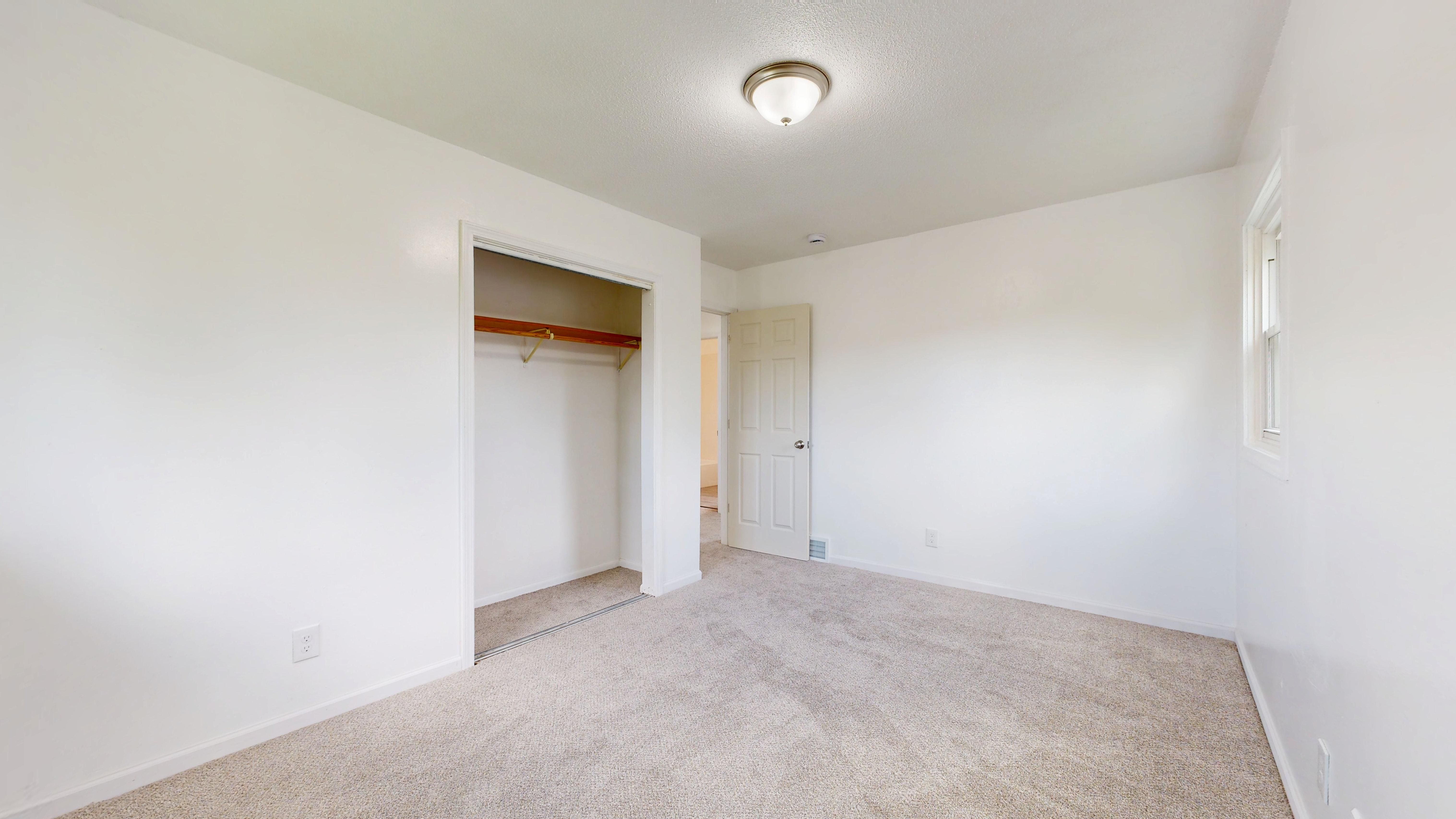 Freshly fitted carpet in an empty bedroom in Peterborough, PE1–PE7 — Cambridgeshire Carpets