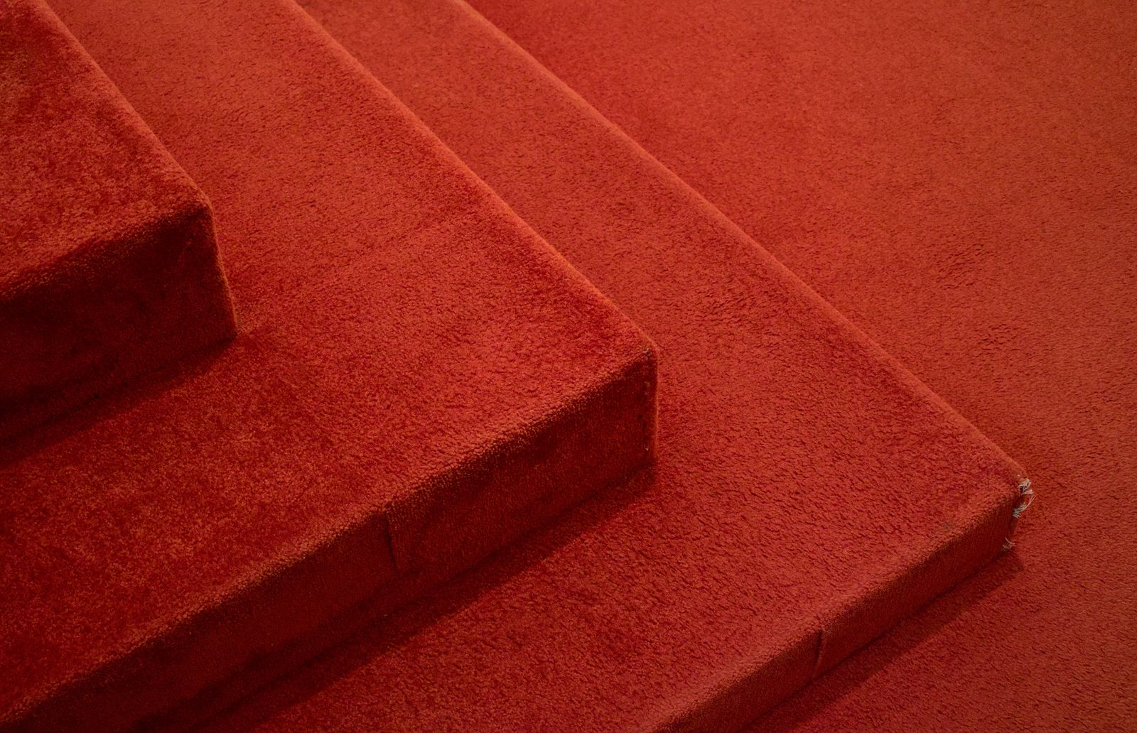 Gripper rod vs adhesive carpet fitting in Peterborough, PE1 — Cambridgeshire Carpets