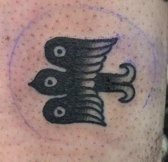small tattoo of a mystical bird