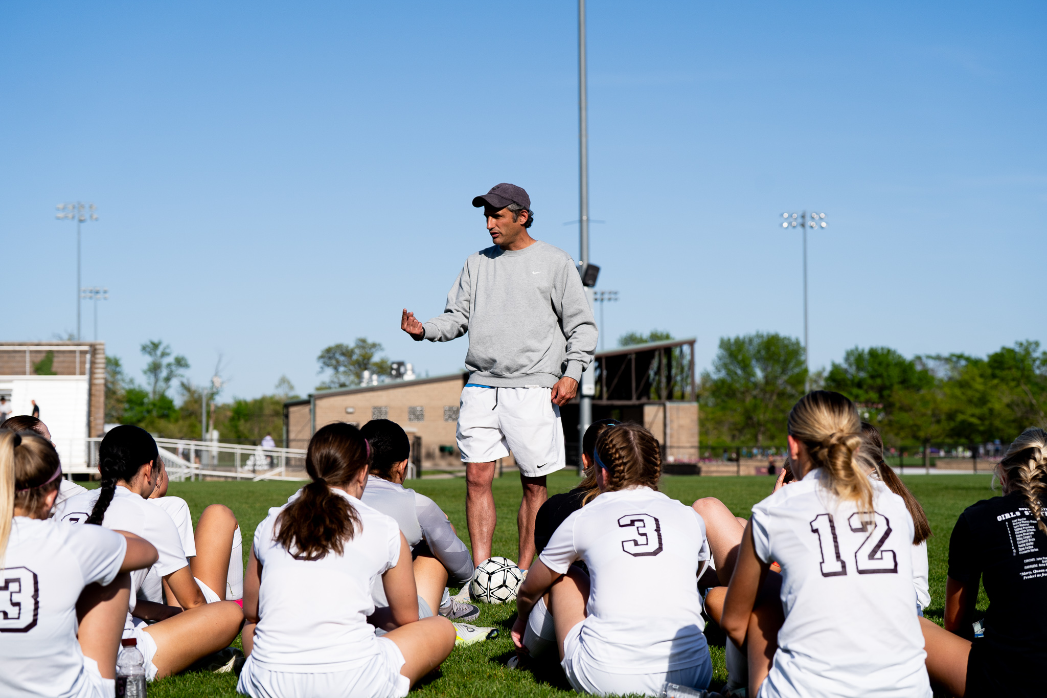 Matt Sahag coaching Dowling Catholic girls soccer game