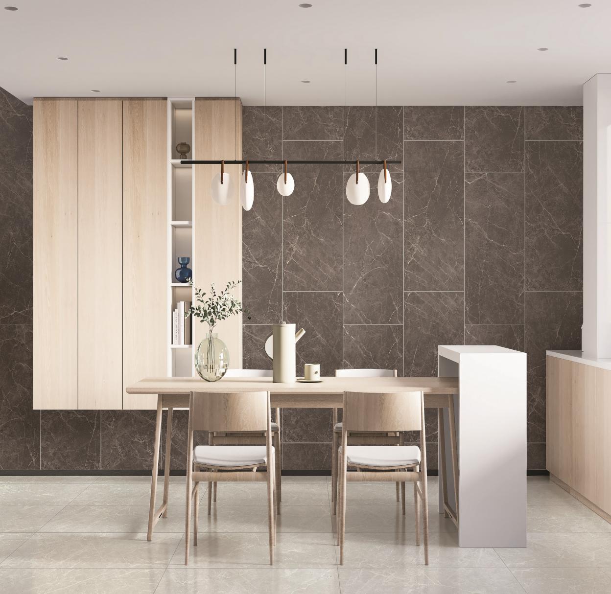 Modern dining area with light wood table and chairs, dark marble tiled wall, and minimalist pendant lighting.