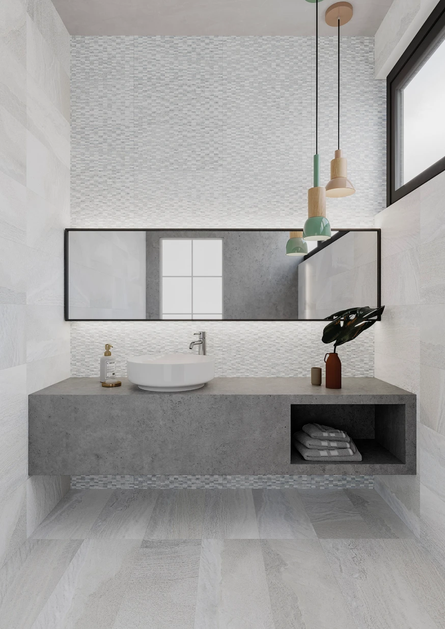 Modern bathroom with a floating concrete vanity, a round white sink, rectangular mirror, pendant lights, and folded towels in an open shelf.