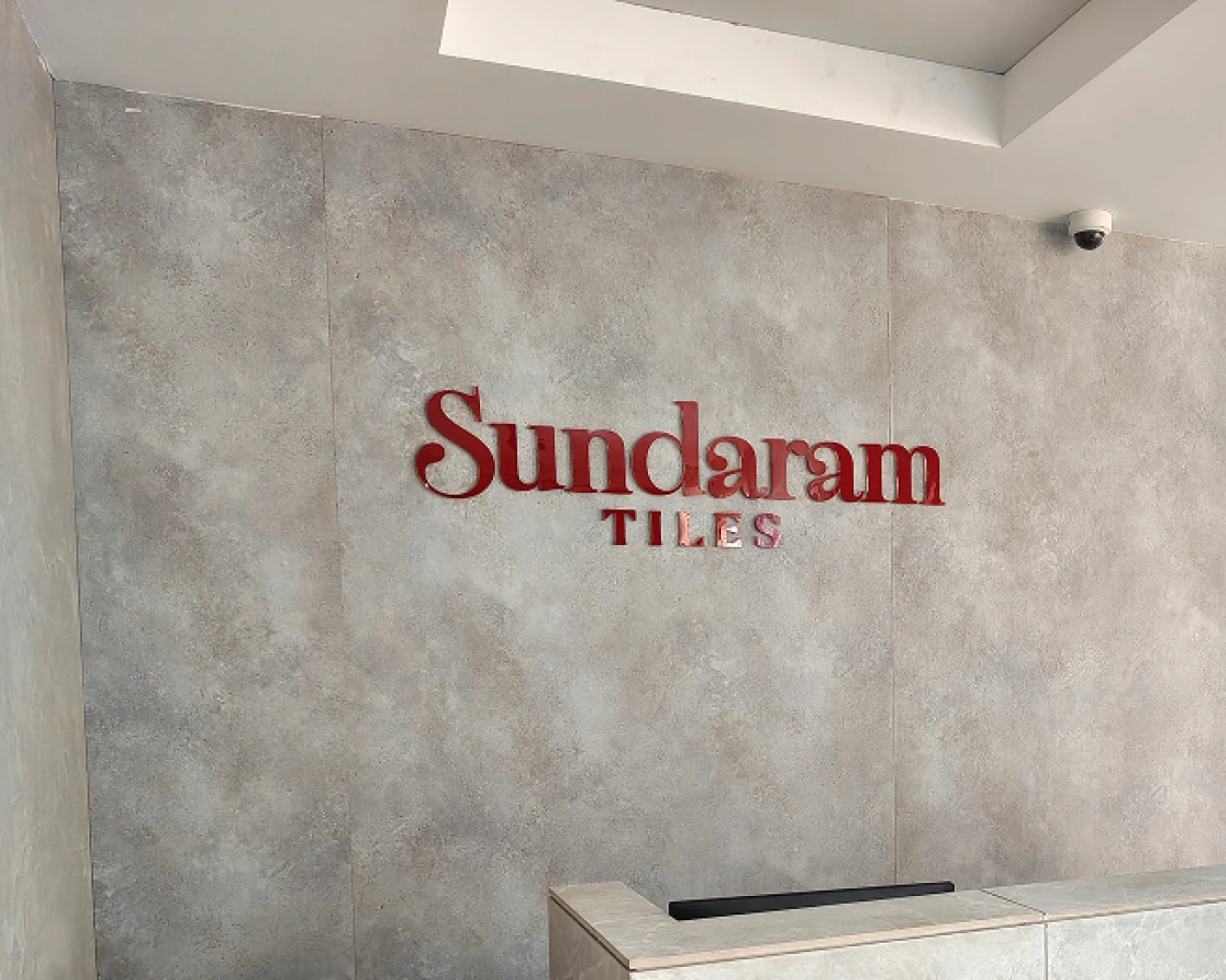 Sundaram's Logo in the showroom wall.