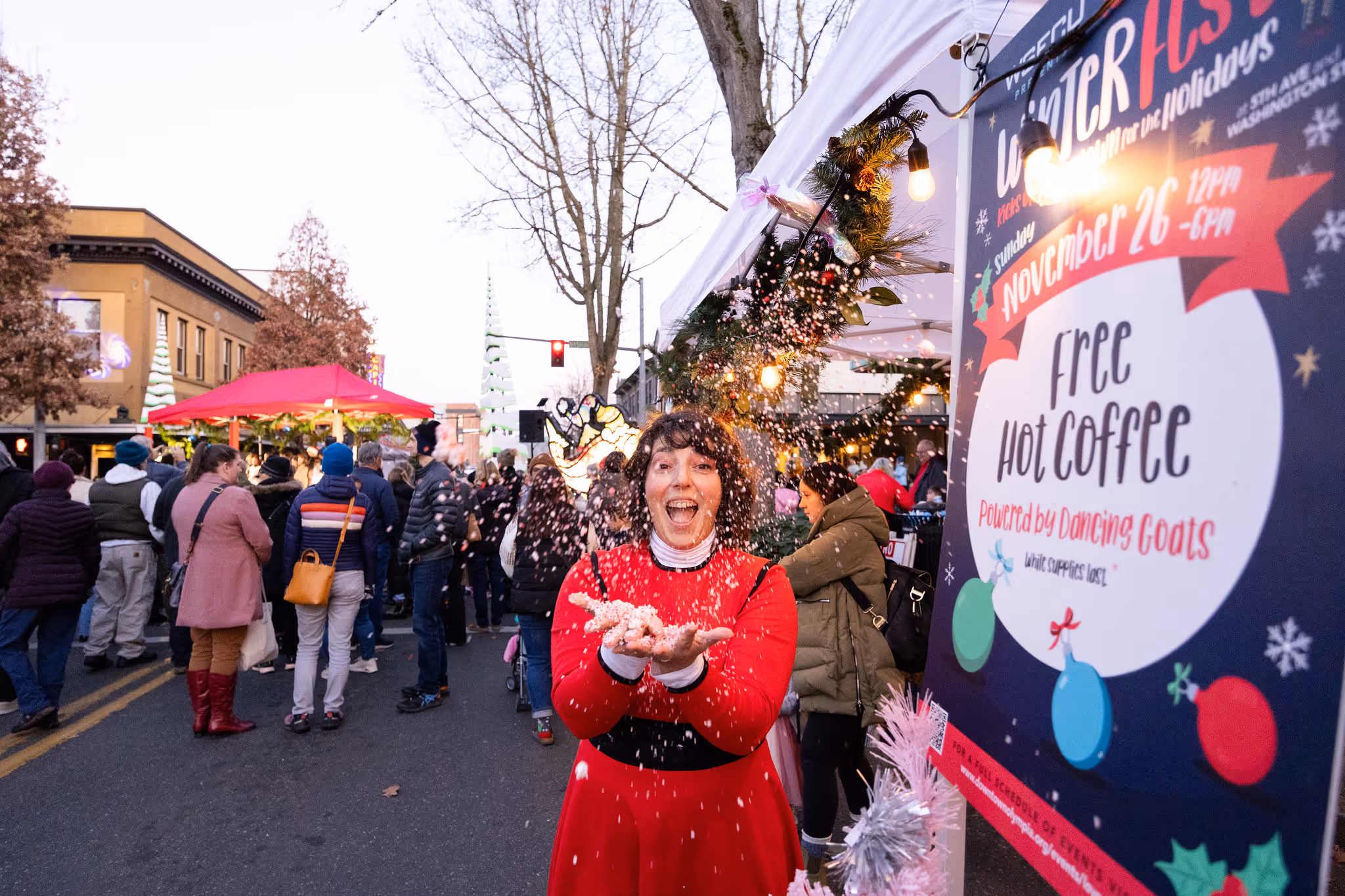 Local business owner throw confetti during downtown celebration. “Photo courtesy of the Olympia Downtown Alliance”