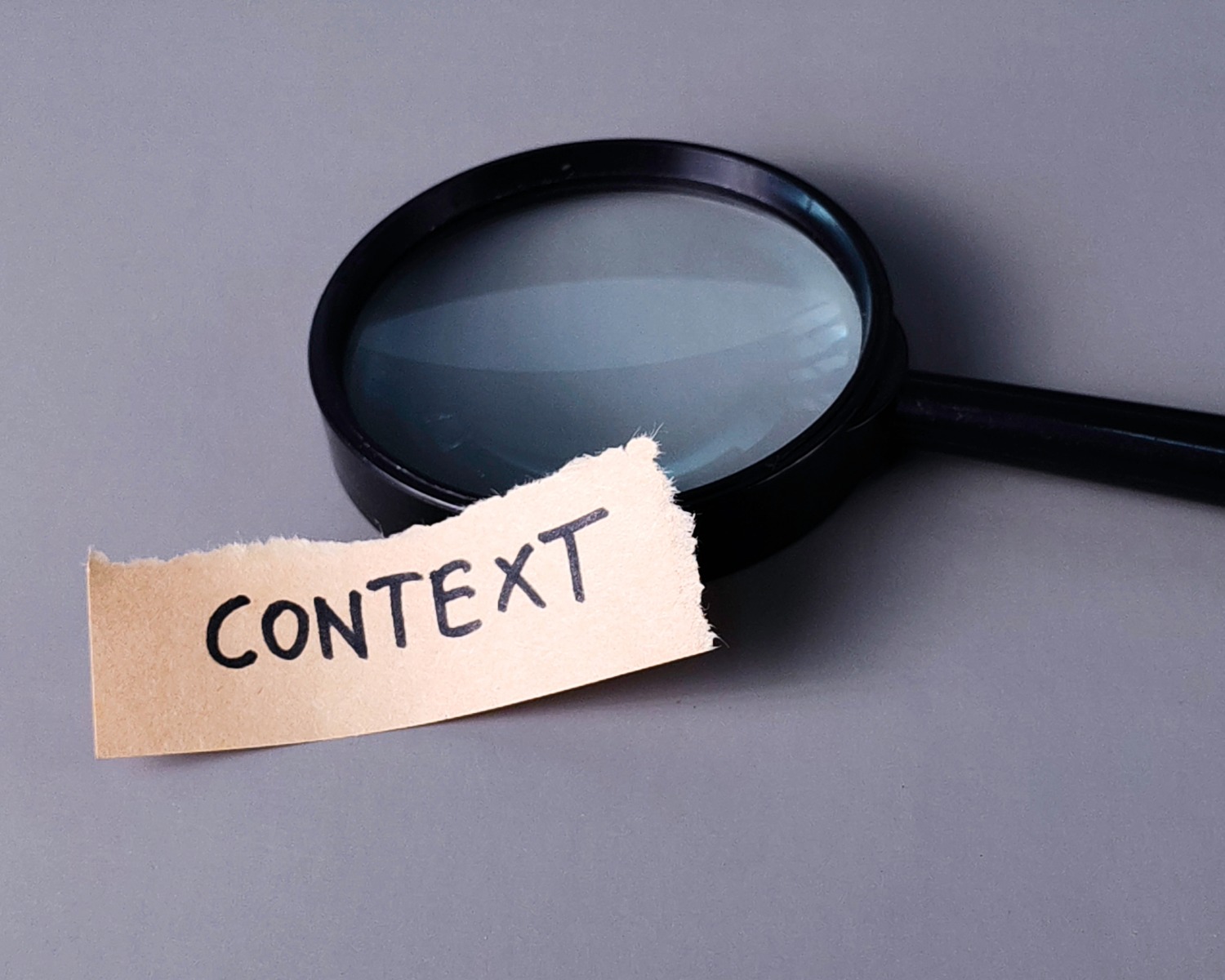picture of a magnifying glass with a note that reads "context" nearby