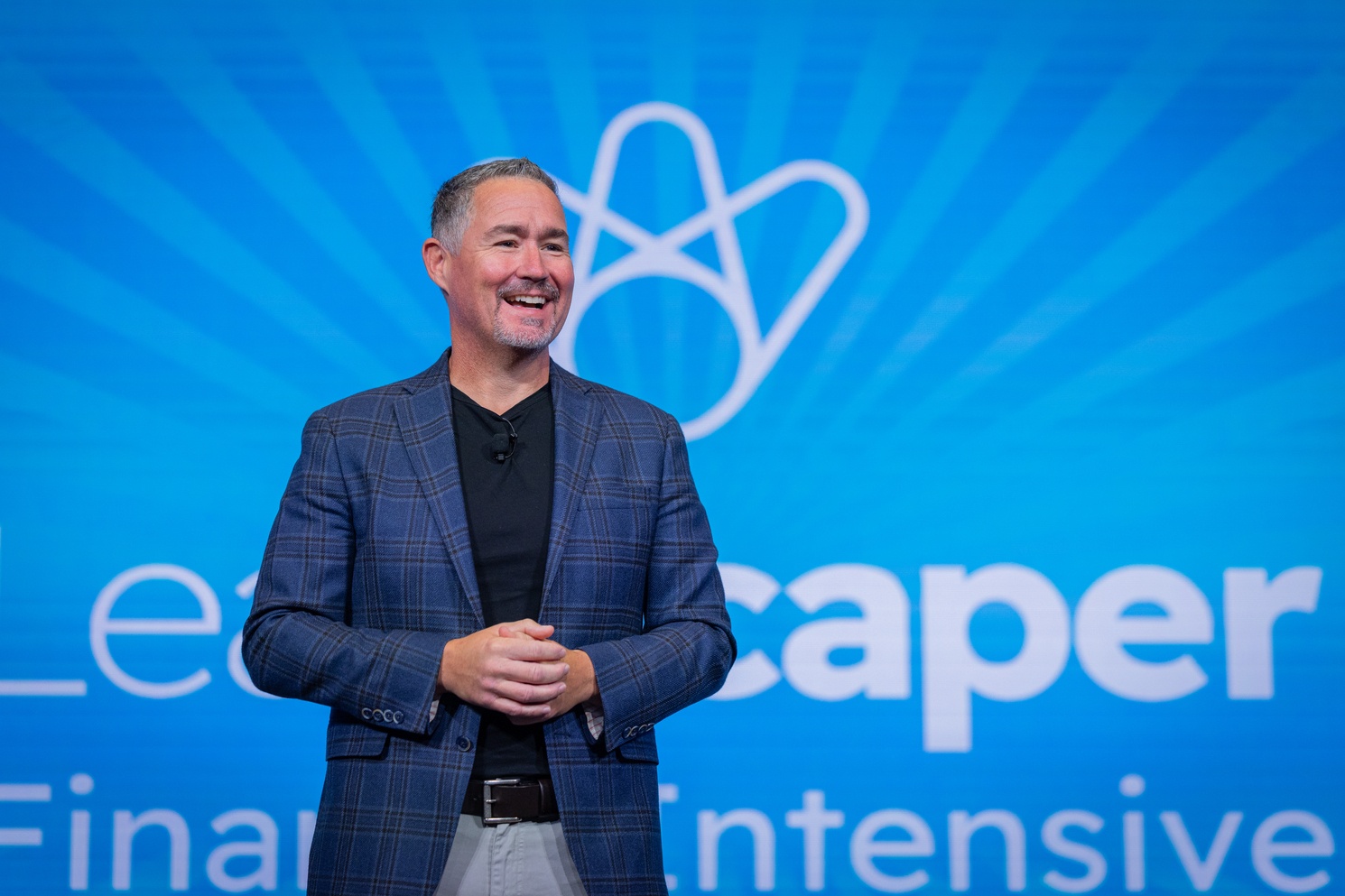 Mark Bradley on stage at the LeanScaper Finance Intensive