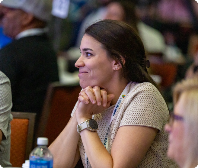 Attendee smiling during the awards