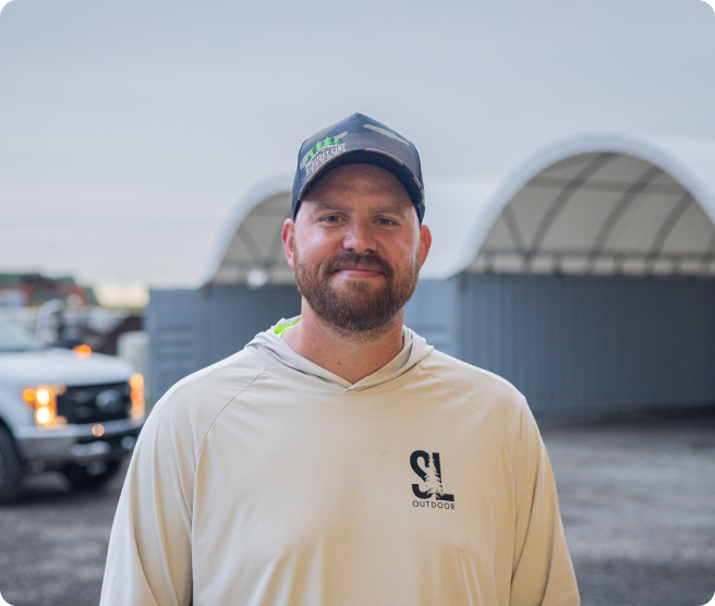 Landscape company owner standing in his yard