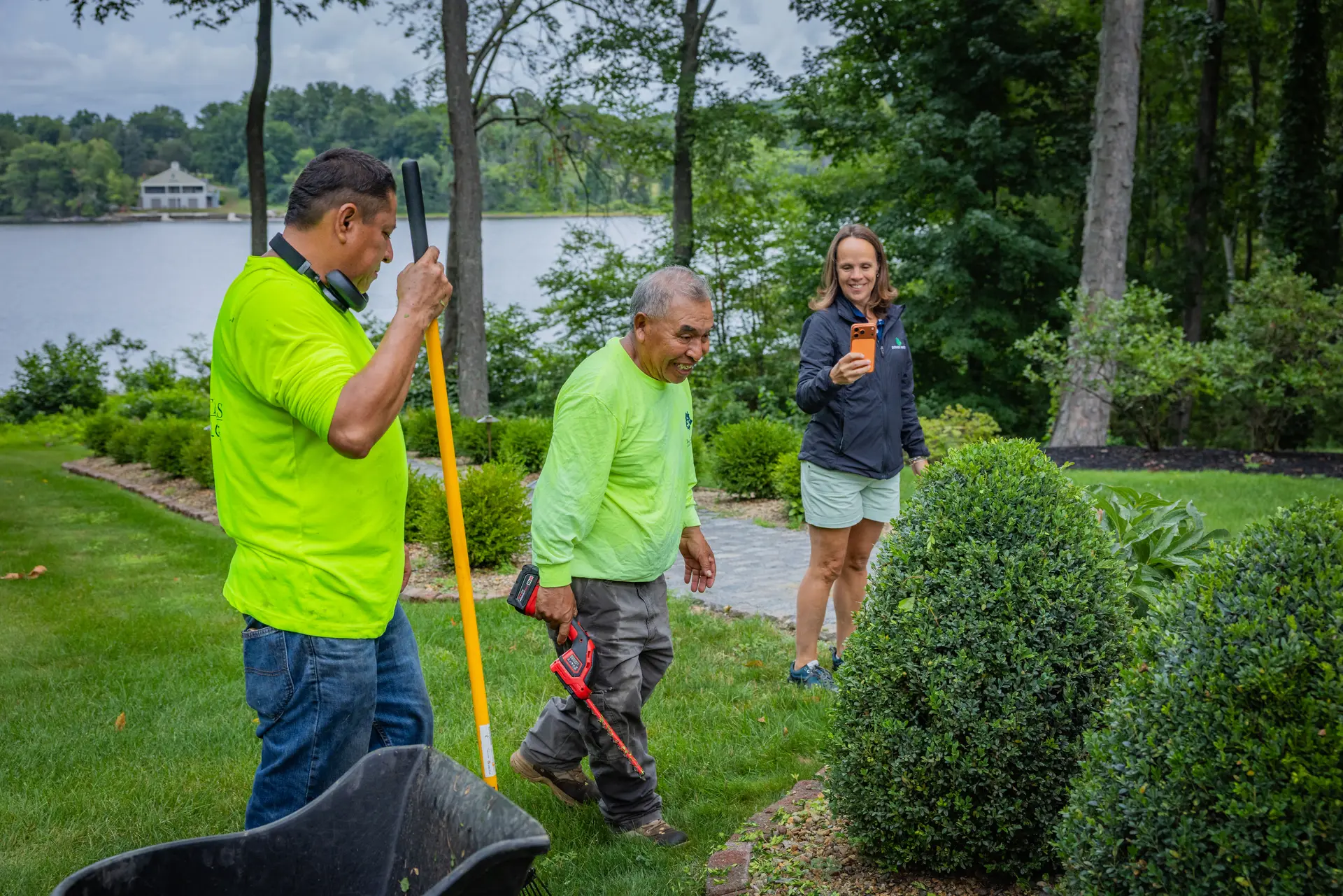 Nicole Downer with two of her crew on a finished property