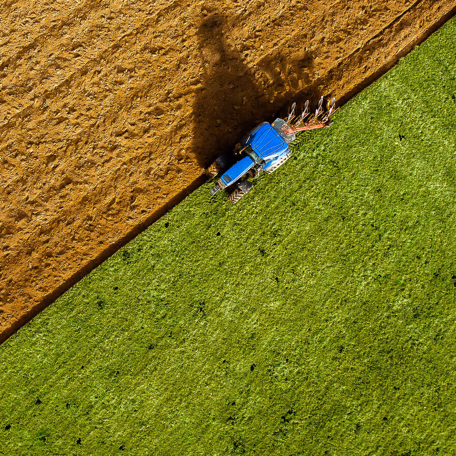 A overhead shot of a tractor plowing a field