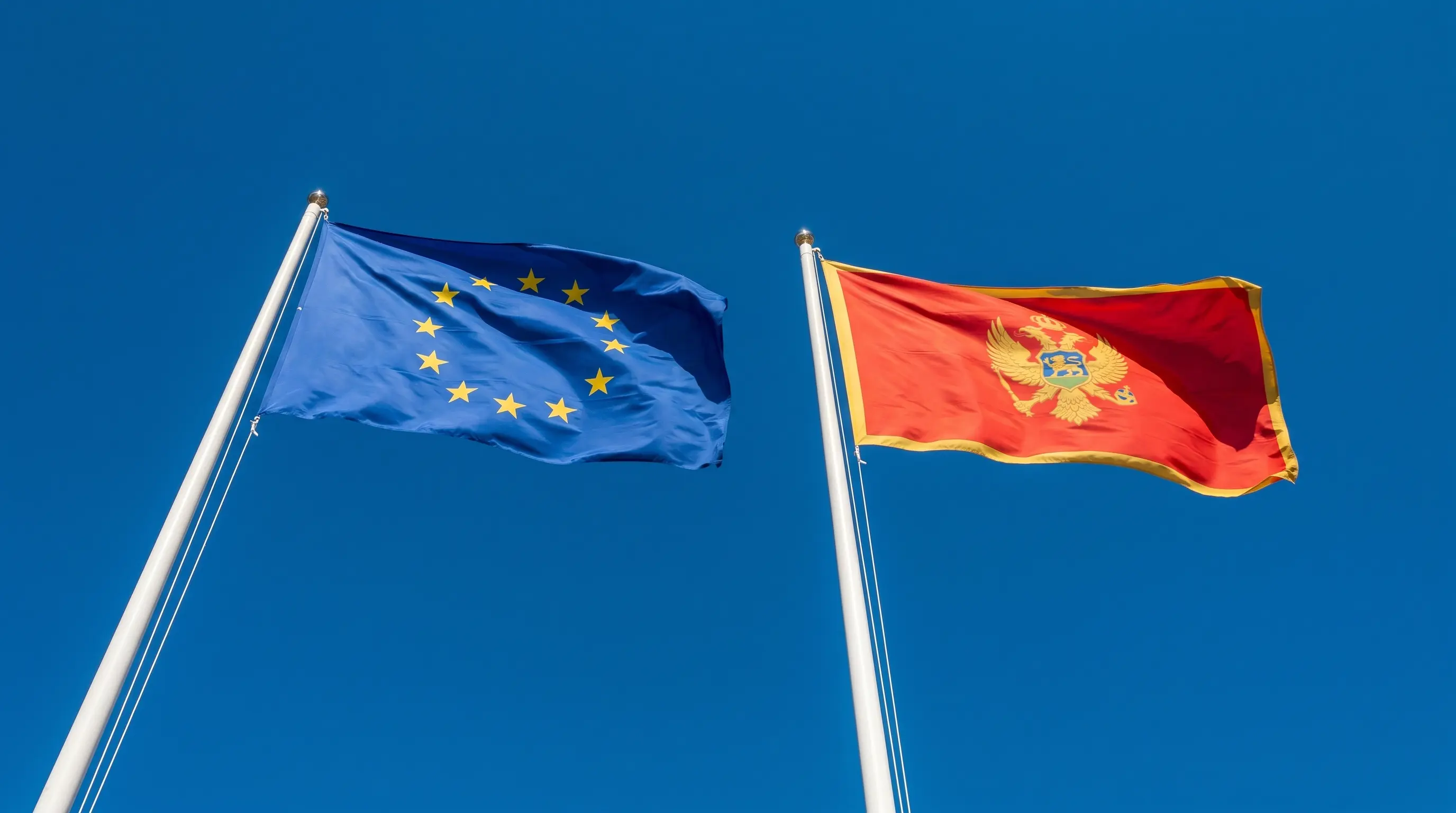 The EU and Montenegrin flags — a relationship that has moved from aspiration to active treaty drafting in 2026