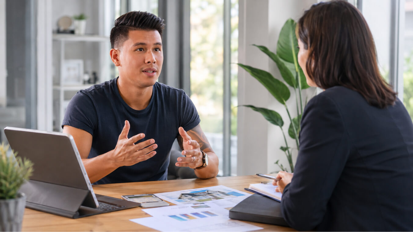 Young Australian veteran discussing DVA asset value limits with an adviser during a financial planning consultation.