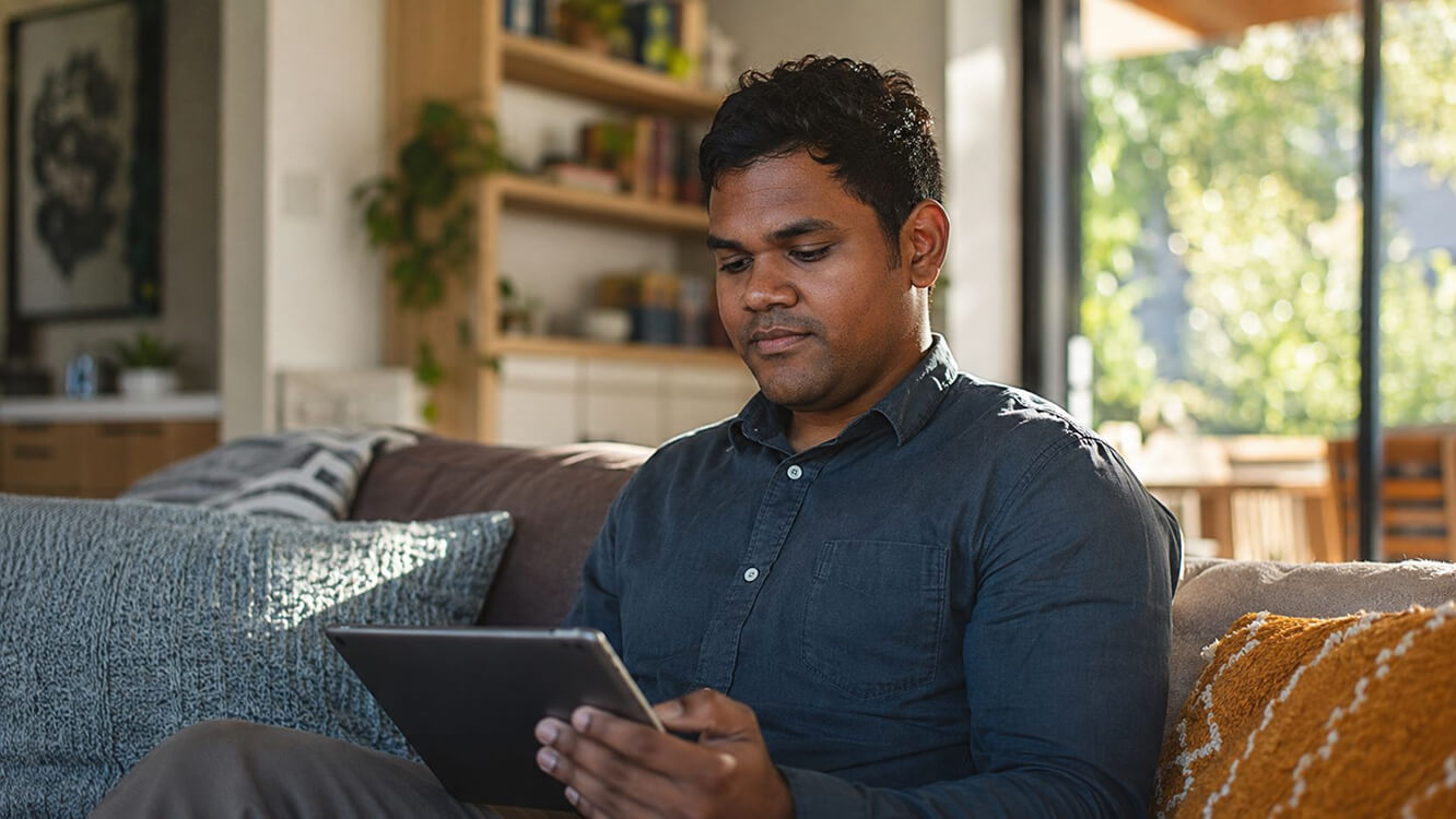 Veteran checking employment support eligibility through the MyService online portal at home.
