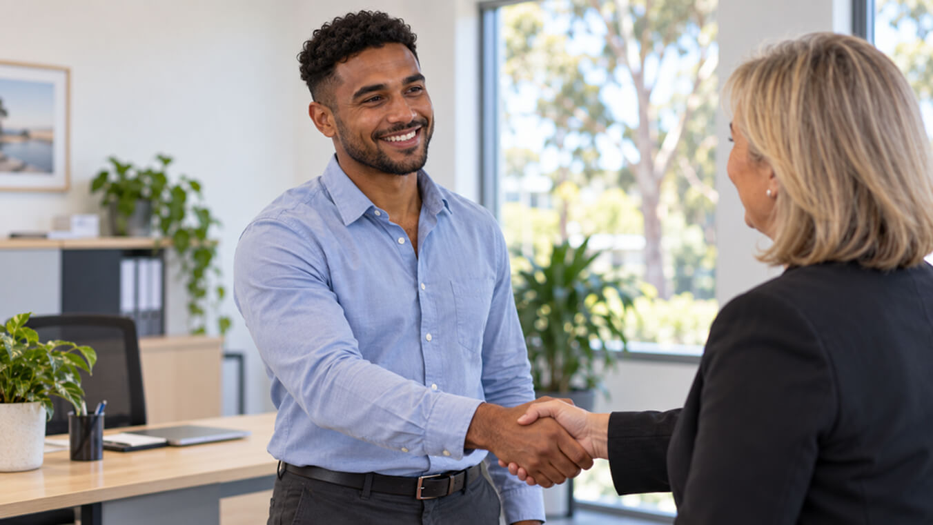 African-Australian veteran meeting with an employment consultant for support transitioning into a civilian career.