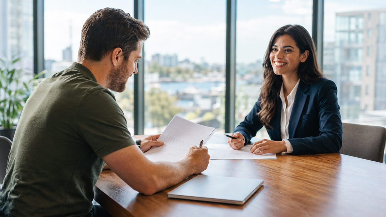 Veteran meeting an independent DVA claims consultant to discuss a permanent impairment reassessment.