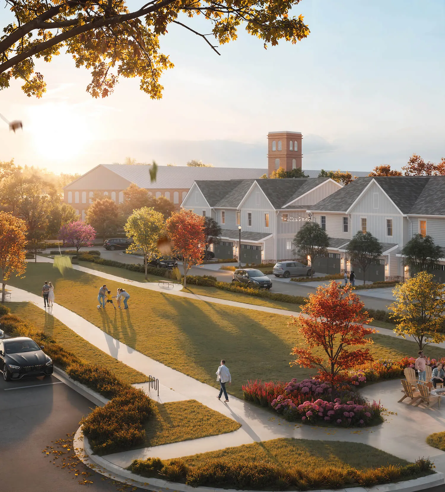 Sunlit neighborhood park with people walking, playing soccer, and sitting near autumn trees and modern houses.