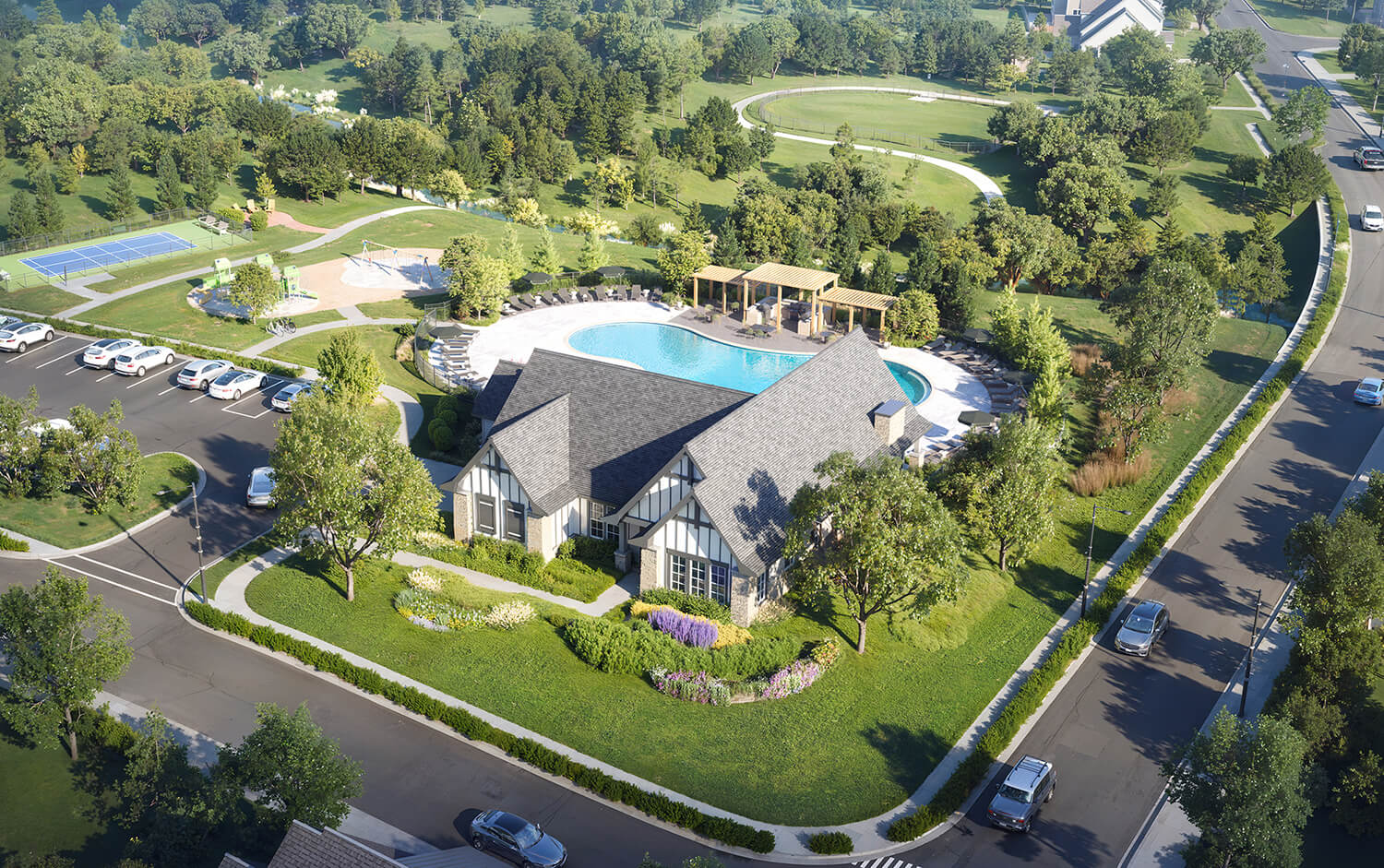 Aerial view of a community clubhouse with a pool, playground, tennis courts, parking, and surrounding greenery.