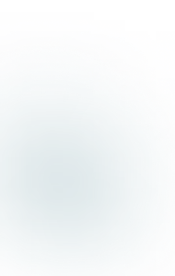 White laptop on a round woven placemat on a white bed, showing a website with a person on the screen.