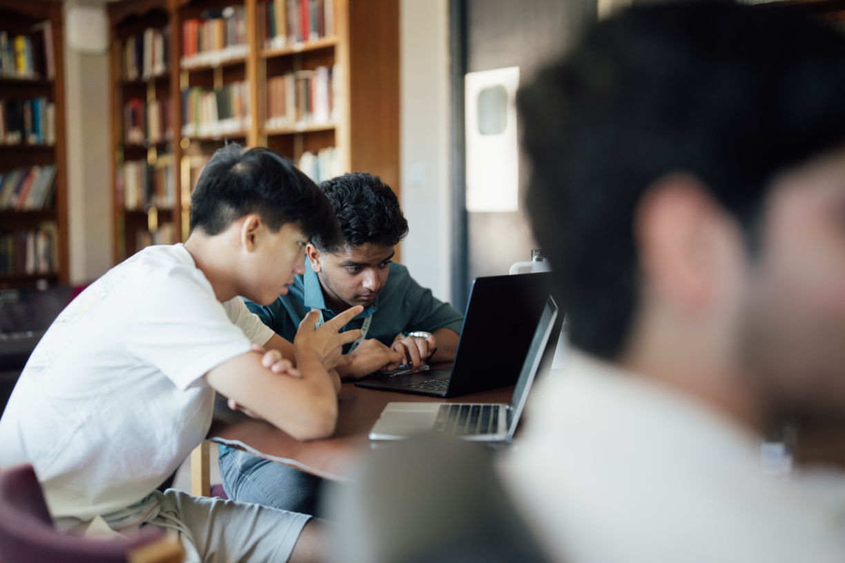 Two students with the laptop
