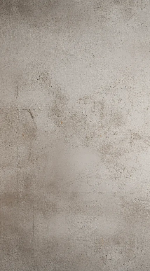 Verwitterte graue Betonwand mit ungleichmäßiger Textur und Flecken.