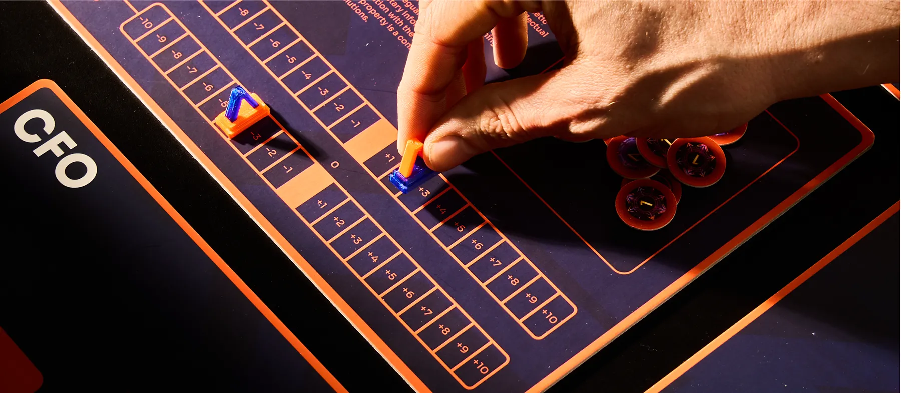 Zoomed in shot of someone interacting with a meeple in the ACEN cardgame.