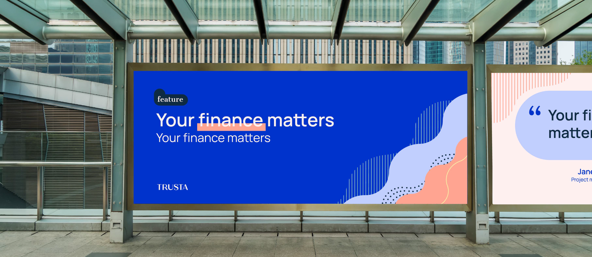 Mockup of a billboard in the streets showing the Trusta brand with some text and graphic elements on the side.